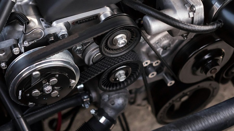 Close-up of the belts and pulleys in a car engine